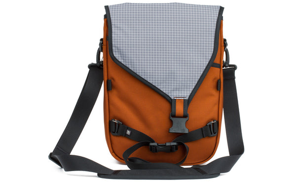 The Ristretto in Burnt Orange 1050 Ballistic with Northwest Sky (light grey with white grid) 200 Halcyon interior.
